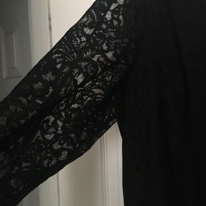 Black shirt. Black camo underneath, lace sleeves